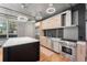 Sleek kitchen with stainless steel appliances and modern cabinetry at 1401 Wewatta St # 204, Denver, CO 80202