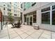 Shared patio with seating area and building views at 1401 Wewatta St # 204, Denver, CO 80202