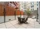 Private patio with seating area and fire pit, perfect for outdoor entertaining at 1401 Wewatta St # 204, Denver, CO 80202