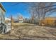 View of large backyard, fenced in with patio, playset and grill area at 114 Walnut Dr, Frederick, CO 80530