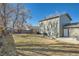 Exterior view of backyard with patio, playset and dining area at 114 Walnut Dr, Frederick, CO 80530