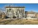 Exterior view of backyard, with patio, barbecue and string lights over outdoor dining area at 114 Walnut Dr, Frederick, CO 80530