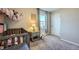 Bedroom featuring neutral carpet, decor and a small window bringing in natural light at 114 Walnut Dr, Frederick, CO 80530