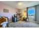 Bedroom featuring neutral walls, carpet, decor and a medium window bringing in natural light at 114 Walnut Dr, Frederick, CO 80530