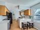 Well-designed kitchen with stainless steel appliances, sleek countertops, a center island and ample cabinet space at 114 Walnut Dr, Frederick, CO 80530