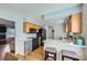 Updated kitchen with light gray walls, quartz counters, and stainless steel appliances at 114 Walnut Dr, Frederick, CO 80530