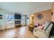 Bright living room featuring a modern fireplace, plush seating, and large windows, perfect for relaxation and entertainment at 114 Walnut Dr, Frederick, CO 80530