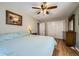 Comfortable bedroom with hardwood floors, a ceiling fan and a closet for storage at 114 Walnut Dr, Frederick, CO 80530