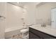 Bright bathroom features a shower-tub combination and a modern vanity with stone countertops at 1954 S Haleyville Way, Aurora, CO 80018