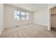 Bright bedroom with plush carpet, recessed lighting, and a large window for natural light at 1954 S Haleyville Way, Aurora, CO 80018