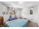 Bright bedroom featuring two windows and an air conditioning unit at 481 Cragmore St, Denver, CO 80221
