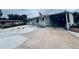 The house provides covered parking and a well-kept yard. An American flag is visible at 481 Cragmore St, Denver, CO 80221