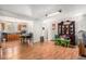 Open-concept living area featuring wood floors connecting to kitchen and dining at 481 Cragmore St, Denver, CO 80221
