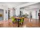 Open-concept dining space featuring hardwood floors, connecting to a living room at 481 Cragmore St, Denver, CO 80221