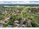 Gorgeous aerial view of the neighborhood with lush trees, walking paths, and a scenic lake at 3916 S Telluride Ct, Aurora, CO 80013