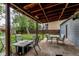 Relaxing covered back patio featuring outdoor seating, perfect for entertaining at 3916 S Telluride Ct, Aurora, CO 80013