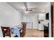 Eat-in kitchen featuring laminate floors and a ceiling fan at 3916 S Telluride Ct, Aurora, CO 80013