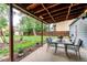 Outdoor patio with dining table and chairs with view of backyard at 3916 S Telluride Ct, Aurora, CO 80013