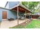 Covered patio with outdoor seating, grill, and access to the backyard at 3916 S Telluride Ct, Aurora, CO 80013
