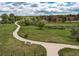 Relaxing paved walking path surrounded by scenic landscapes and lush greenery, perfect for leisurely strolls and fitness at 3916 S Telluride Ct, Aurora, CO 80013