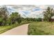 Picture of a paved walking path through lush green spaces, encouraging residents to enjoy outdoor activities and relaxation at 3916 S Telluride Ct, Aurora, CO 80013