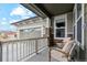 Covered front porch with seating and railings at 17214 W 94Th Ave, Arvada, CO 80007