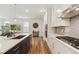 Kitchen with a center island, stainless appliances, and hardwood floors at 17214 W 94Th Ave, Arvada, CO 80007