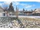 Large backyard with gravel and grass areas, partially covered by snow at 9163 W 75Th Cir, Arvada, CO 80005