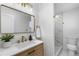 Modern bathroom with marble shower and gold fixtures at 9163 W 75Th Cir, Arvada, CO 80005