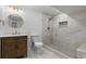 Basement bathroom with walk-in shower, vanity, and toilet at 9163 W 75Th Cir, Arvada, CO 80005