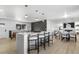 Open concept kitchen and living area with modern design and island at 9163 W 75Th Cir, Arvada, CO 80005