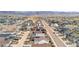 Expansive aerial view showcasing the neighborhood layout and mountain backdrop at 8028 Williams Fork Ave, Littleton, CO 80125