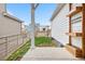 View of the home's yard and patio featuring wood accents and green grass at 8028 Williams Fork Ave, Littleton, CO 80125
