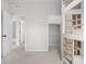 Bedroom with bunk beds and an adjacent hallway and closet at 8028 Williams Fork Ave, Littleton, CO 80125