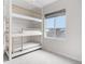Bright bedroom featuring a bunk bed and natural light from the window at 8028 Williams Fork Ave, Littleton, CO 80125