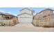 Exterior of the home with a two-car garage and driveway at 8028 Williams Fork Ave, Littleton, CO 80125