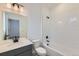 Bathroom with a white subway tile shower and black hardware at 1759 Peak Loop, Broomfield, CO 80023