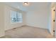 Clean, carpeted bedroom with a window providing plenty of natural light at 1759 Peak Loop, Broomfield, CO 80023