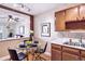 Cozy dining area with a glass table, black chairs and updated kitchen nearby at 745 S Alton Way # 9B, Denver, CO 80247