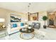 Comfortable living room with view to kitchen featuring stylish décor and ample seating at 745 S Alton Way # 9B, Denver, CO 80247