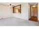 Open living room with view of kitchen and hallway entrance at 745 S Alton Way # 9B, Denver, CO 80247