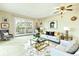Bright living room featuring a balcony, modern furniture, and stylish decor at 745 S Alton Way # 9B, Denver, CO 80247