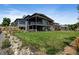 Modern home with a large, well-maintained backyard and covered patio, ideal for outdoor living and entertaining at 10106 W 69Th Pl, Arvada, CO 80004