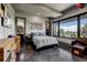 Spacious bedroom with large windows offering scenic views and lots of natural light at 10106 W 69Th Pl, Arvada, CO 80004