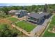 Stunning home featuring a manicured lawn, mountain views, and a spacious outdoor living area at 10106 W 69Th Pl, Arvada, CO 80004