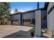 Modern exterior with oversized garage doors, offering ample space for vehicles and storage at 10106 W 69Th Pl, Arvada, CO 80004