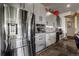 Sleek modern kitchen with stainless steel appliances and custom cabinetry at 10106 W 69Th Pl, Arvada, CO 80004