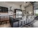 Contemporary kitchen with a large island, sleek cabinets, stainless steel appliances, and stylish barstool seating at 10106 W 69Th Pl, Arvada, CO 80004