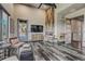 Stunning living room featuring a modern fireplace, wood accents, and stylish decor at 10106 W 69Th Pl, Arvada, CO 80004