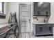 Functional mud room with modern appliances, storage cabinets, and a utility sink, seamlessly blending practicality and style at 10106 W 69Th Pl, Arvada, CO 80004
